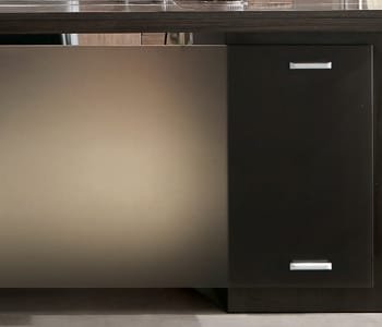 It creates a refined image using tempered glass with bronze color on desk front.