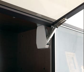 Tower storage door using flap hinge that can control pressure while opening and shutting moves smoothly, and protects any damage occurred by any sudden operation.