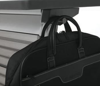 Users can hang their bag on a bag holder on the side.